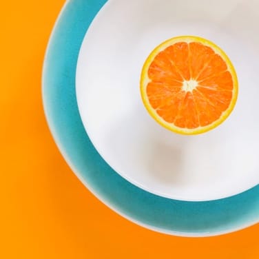 Photo of an orange in a bowl